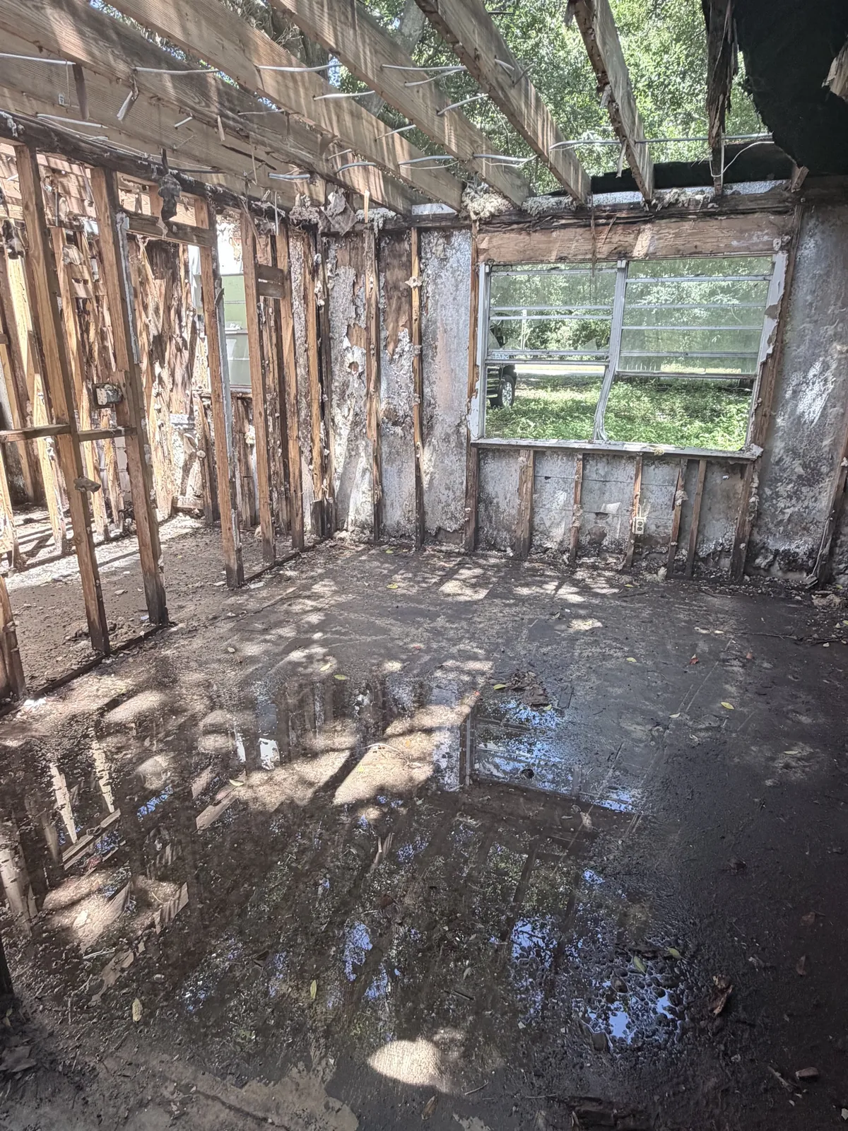 Interior demolition debris removal in progress