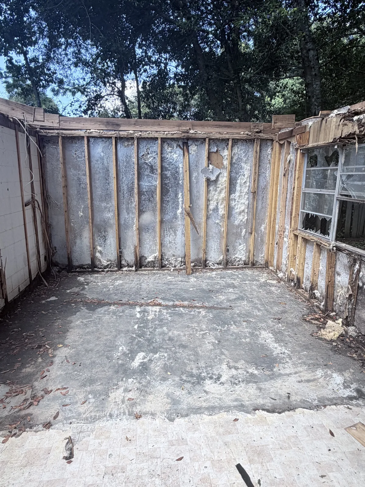 Clean concrete floor after demolition debris removal