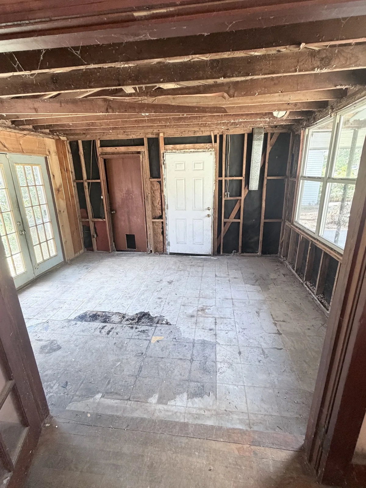 Room stripped to framing during demolition