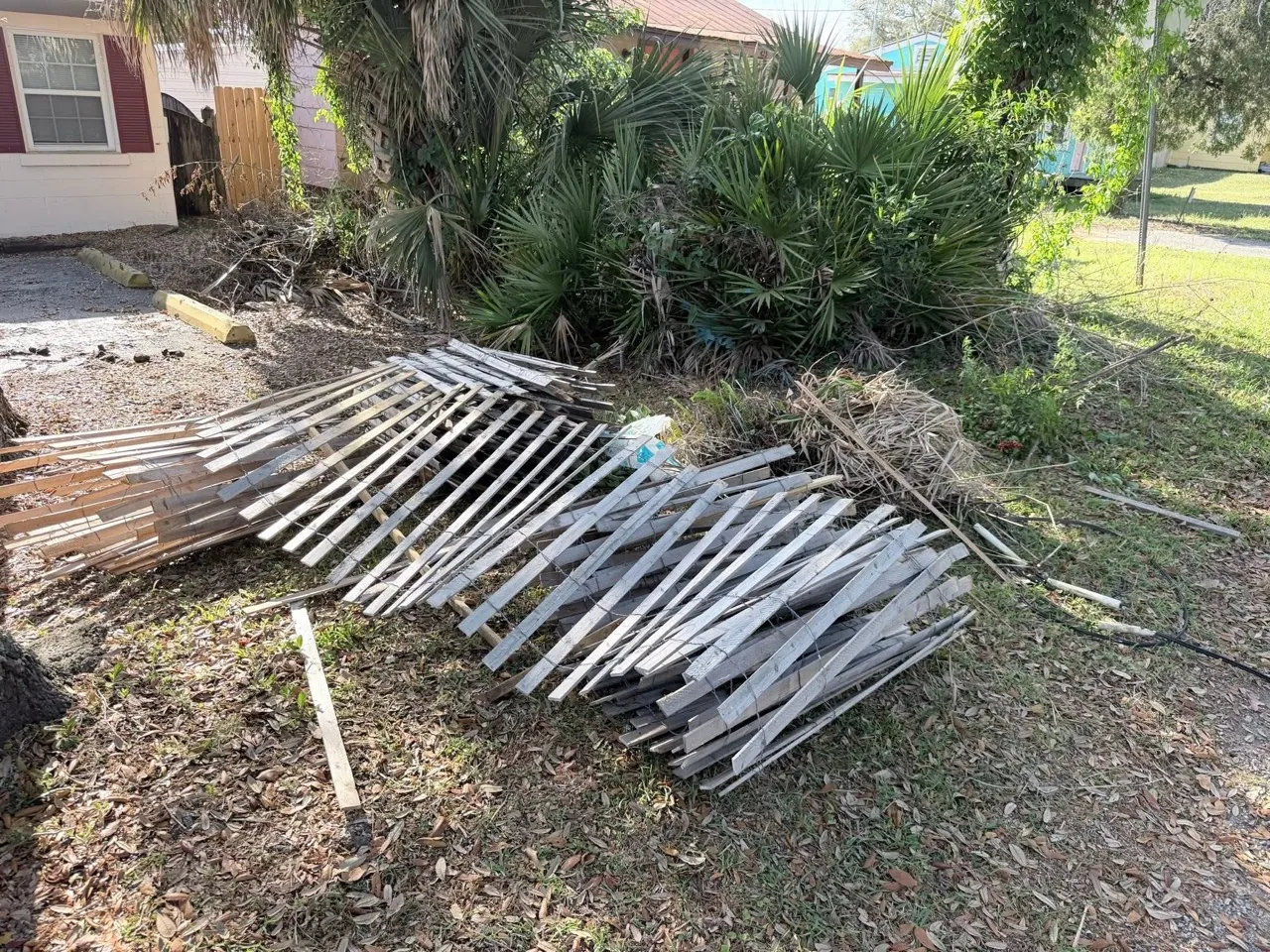 Fence panels ready for debris removal