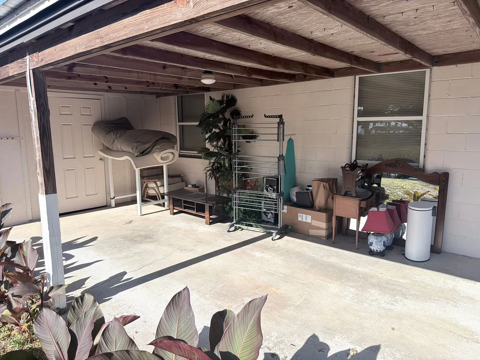 Covered patio before cleanup
