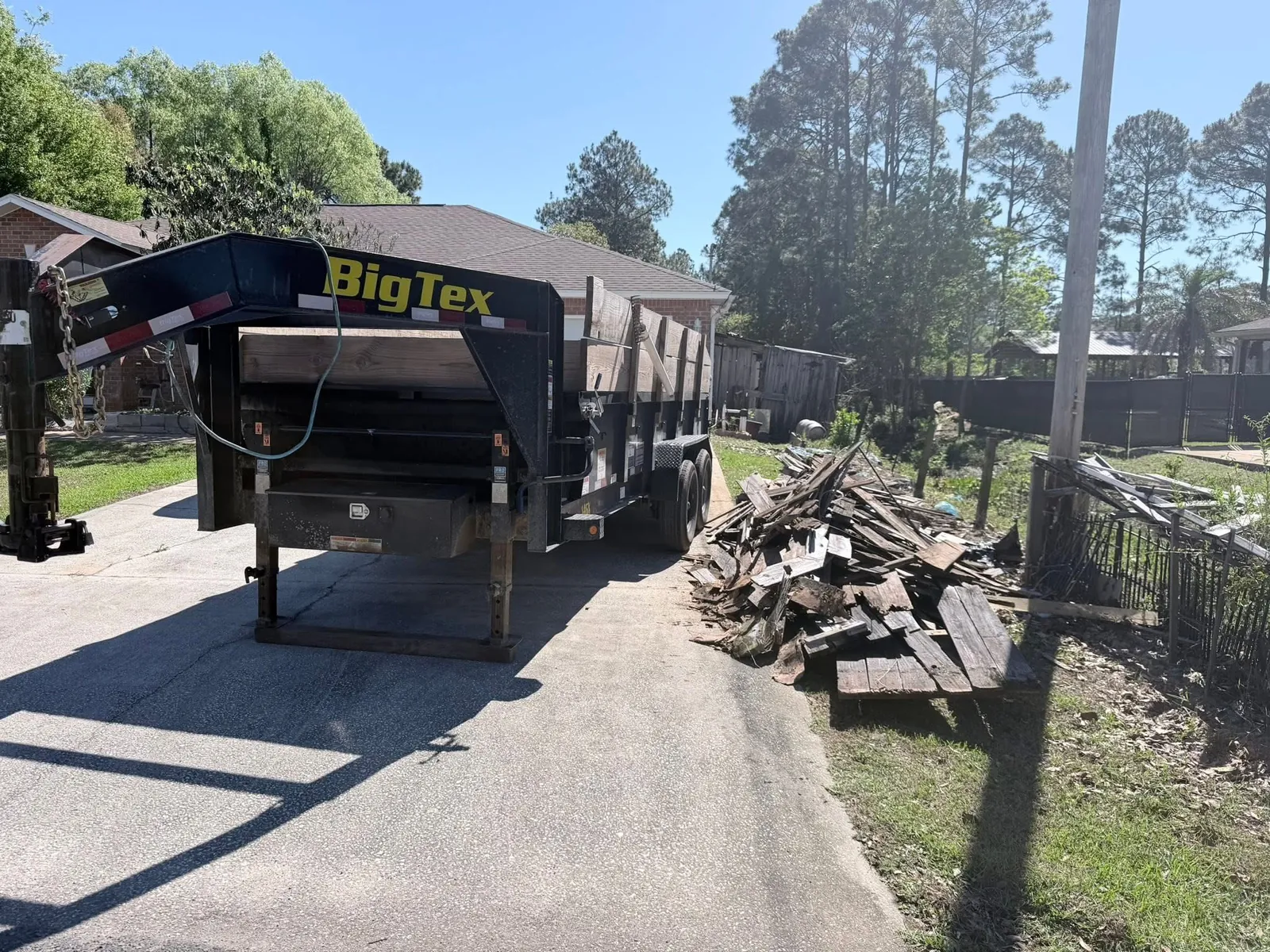 Dump trailer staged for residential debris removal