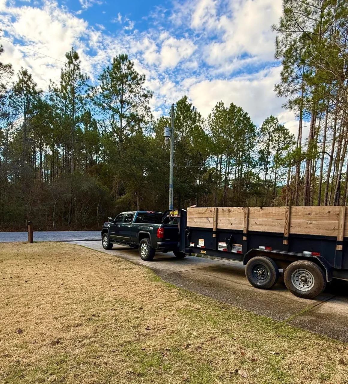 Wallworth truck and dump trailer on a residential driveway